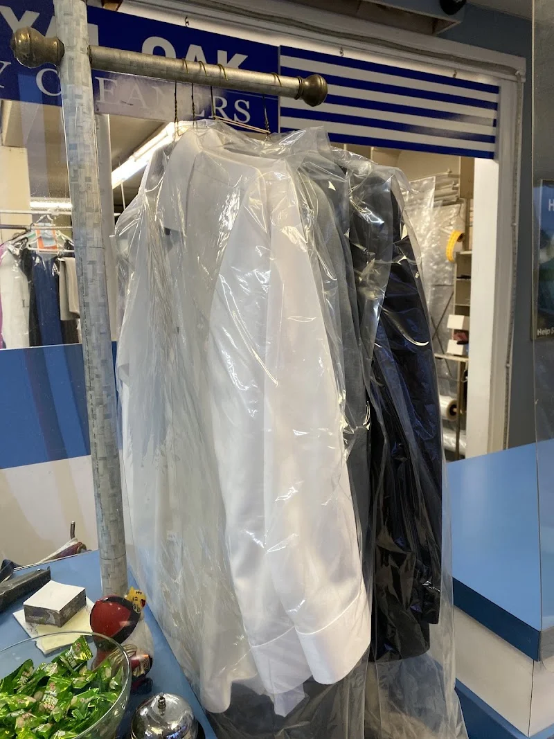 Interior of Royal Oak Drycleaners with garment racks and equipment